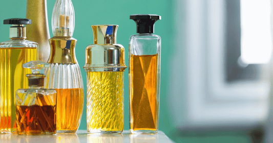 A collection of fragrance bottles of perfumes from different olfactory families.